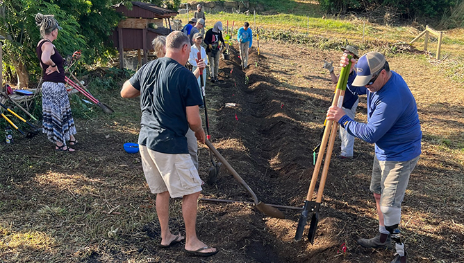 Farmers working the land to make it more fertile and increase local food access